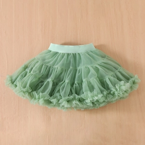 Detailed macro of multi-layered light green tulle tutu with elastic waistband for girls