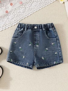 Girl's summer outfit with beaded top and dark wash denim shorts featuring daisy embroidery