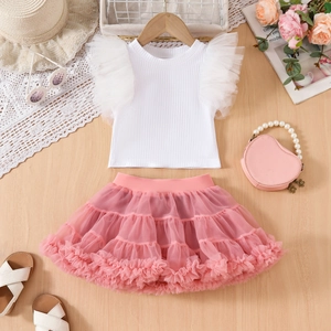 Detail of girls' white ruffle sleeve top and pink tiered mesh tutu skirt set