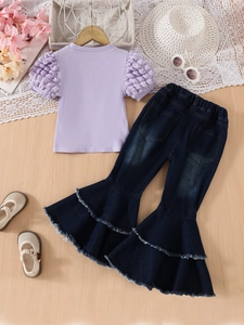 Girls 2-piece set with lilac puff sleeve top and dark flared jeans with ruffled hems
