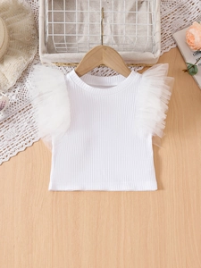 Sweet white ribbed cotton top for girls with layered mesh ruffle sleeves on a wooden hanger