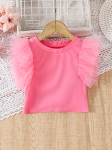 Top in maglia rosa per bambina con maniche in tulle su appendino in legno