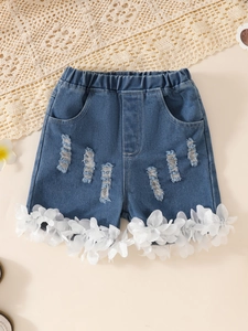 Girls dark blue denim shorts with elastic waist and white petal lace trim on hem
