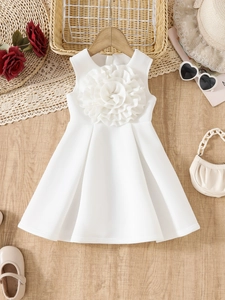 Elegant white sleeveless girl princess dress with 3D floral decoration on wooden background