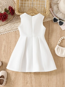 Close-up of white sleeveless princess dress back with hidden zipper and pleated skirt