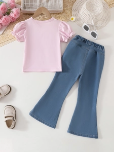 Girls summer outfit featuring pink puff sleeve top and printed washed flare denim jeans