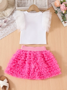 Detail of girls' white ribbed top with ruffled mesh sleeves and pink layered tutu skirt