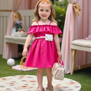 Detail of rose red girls' dress featuring ruffled neckline and white waist belt with mini bag