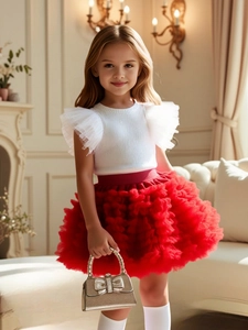 Girls white ruffle top and red tutu skirt two-piece set for stylish princess look