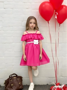 Girl's pink off-shoulder dress with ruffled neckline and decorative waist belt and bag