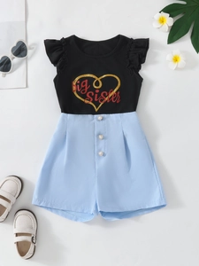 Girls summer two-piece outfit with black big sister heart tee and blue pearl shorts