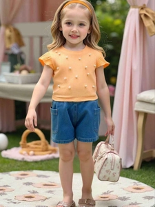 Girls orange pearl knit top with ruffled sleeves and denim shorts two-piece summer set