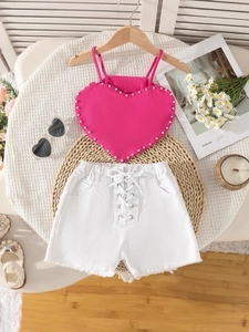 Girls summer two-piece outfit with pink heart pearl top and white denim shorts