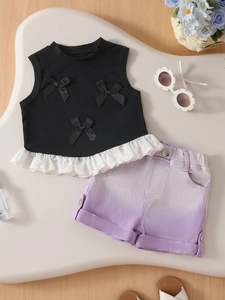 Girls summer set featuring black bow tank top with lace trim and lavender twill shorts
