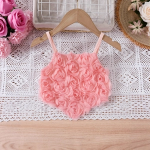 Detail of pink 3D rose petal texture on children's floral tutu princess dress bodice