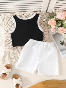 Girls summer fashion set featuring a black and white sleeveless top and white denim shorts