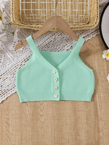 Gilet in maglia verde menta per bambina con bottoni a margherita dal design minimale