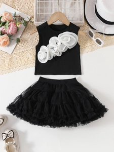 Detail of girls' black tutu set with 3D mesh flowers on sleeveless top and layered skirt