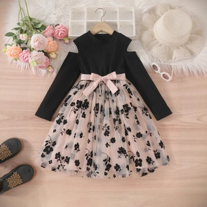 Detail of girls' black cold shoulder top with pink floral mesh tutu skirt and bow