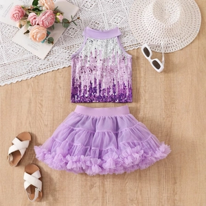 Flat lay of girl's purple sequin halter top and layered mesh tutu skirt outfit set