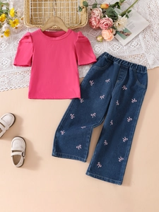 Girls 2-piece outfit featuring pink bubble sleeve top and bow embroidered denim pants