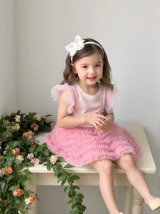 Pink girls' summer set with knit tank top, mesh tutu cake skirt, and matching bow headband