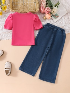 Pink puff sleeve t-shirt and wide-leg denim pants set for girls in a flat lay setup