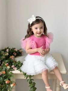 Pink rib-knit top with mesh ruffles and white tiered tutu skirt for toddler girls