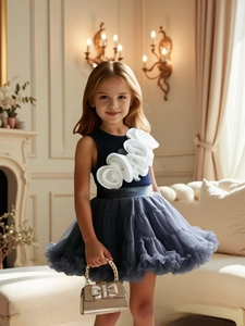 Elegant girls' sleeveless party dress with large white floral accents and tutu skirt