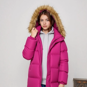 Detail of a bright purple quilted hooded coat for girls with fluffy faux fur trim hood