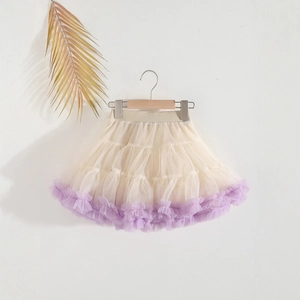 Detailed view of girls' tiered tutu skirt with cream mesh and purple frill hemline