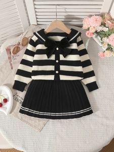 Girls' black and white striped knit cardigan and pleated skirt set with large bow detail