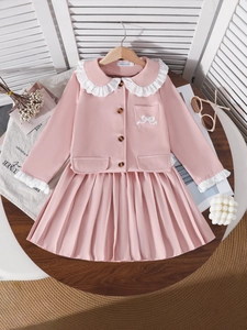 Pink two-piece tweed jacket and pleated skirt set for girls with lace collar and bow detail