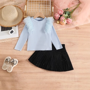 Girl's blue ribbed long sleeve top with mesh ruffles and black pleated sequin skirt