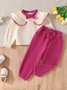 Cute toddler girls ruffled long sleeve top and pants set with bow detailing in rose pink