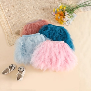 Detail of layered tulle tutu skirts showing elastic waist and soft mesh texture