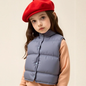 Close-up of kids thickened light blue vest with stand-up collar and button details