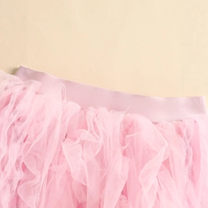 Close-up of pink layered tutu skirt showing soft mesh texture and elastic waistband