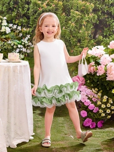 Detail of layered green organza ruffles on white sleeveless 3D floral girls dress