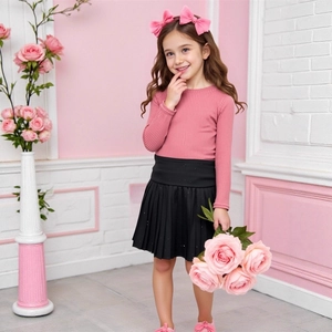 Girls long sleeve pink ribbed top and black pleated skirt set for autumn fashion