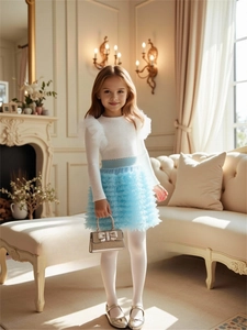 Elegant girls' white knit top with tulle trim and light blue layered mesh skirt outfit