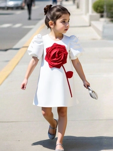 White flower girl dress with large red 3D rose, pearl puff sleeves and A-line silhouette