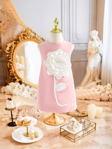 Elegant pink sleeveless girl's party dress featuring a large 3D white floral applique