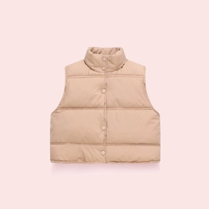 Detail view of beige puffer vest showing horizontal quilting and stand collar design