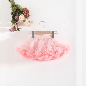 Detail of light pink layered tutu skirt showing soft mesh tiers and elastic waistband