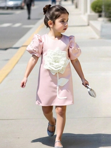 Pink satin girl dress with puff sleeves, white pearl accents, and 3D floral decoration
