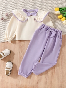 Girls long-sleeve beige top with purple ruffle bow and matching trousers two-piece set