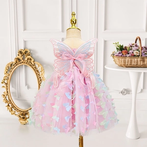Detail of pink fairy tulle dress featuring 3D butterfly appliqués and mesh wings