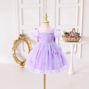 Detailed view of purple princess dress featuring 3D butterfly appliques and puff sleeves