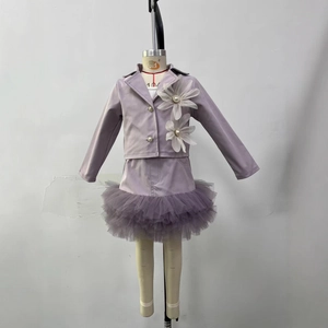 Detail of purple long sleeve girls blazer with large white 3D flowers and tulle skirt